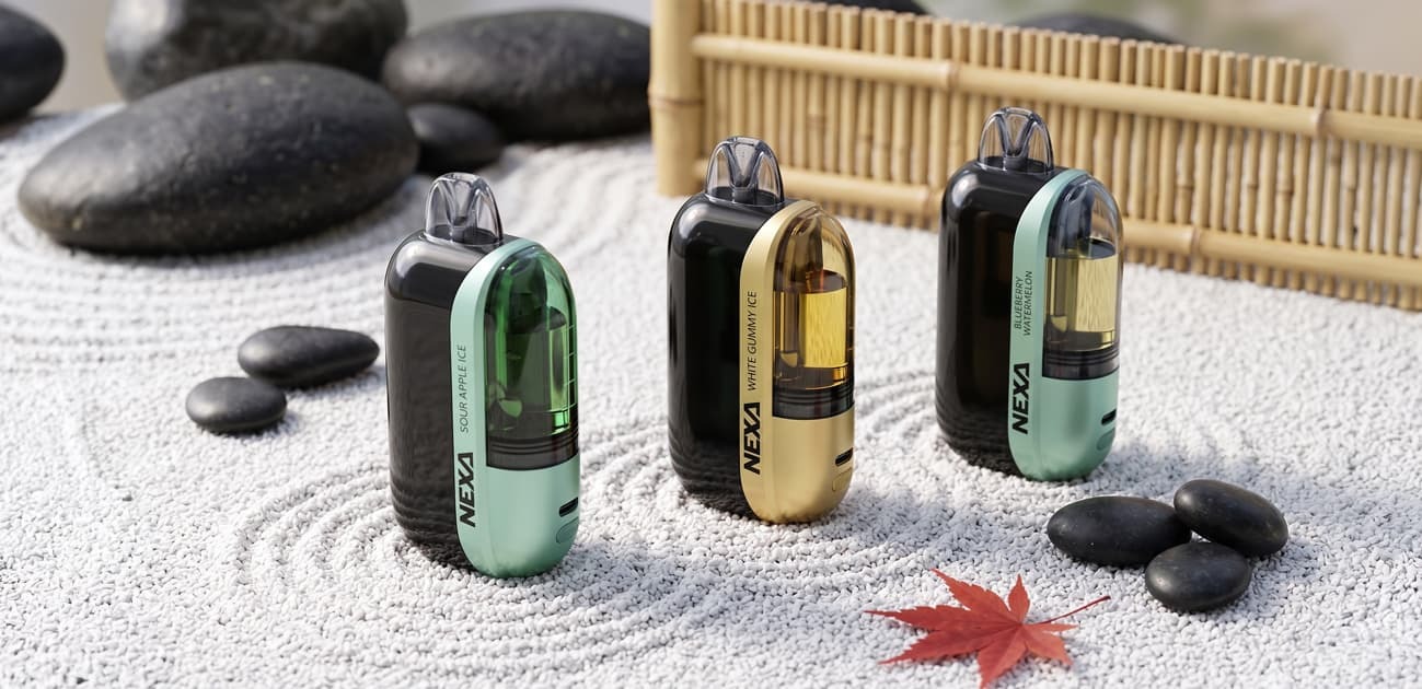 Nexa Ultra disposable vape devices displayed on sand with multiple flavors, compact pod design, and premium aesthetic setup